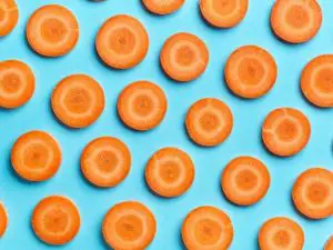 carrot slices on blue background