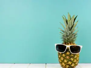 a pineapple with sunglasses on