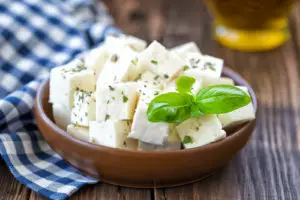white cheese cubes in a bowl on a table