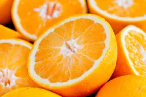 Close up photograph of a bunch of oranges