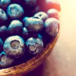 Large group of blueberries in wooden bowl,selective focus