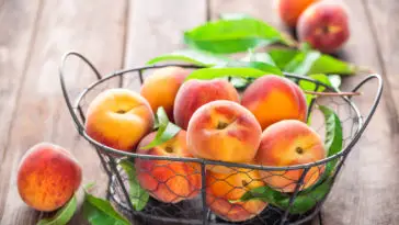 peaches in a basket on a table
