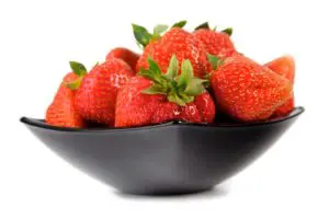 Studio shot of strawberries in bowl - can shih tzus eat strawberries