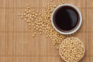 soybeans and soy sauce on a table