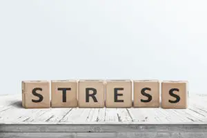 The word stress on a sign made of wooden blocks in a bright room on a table